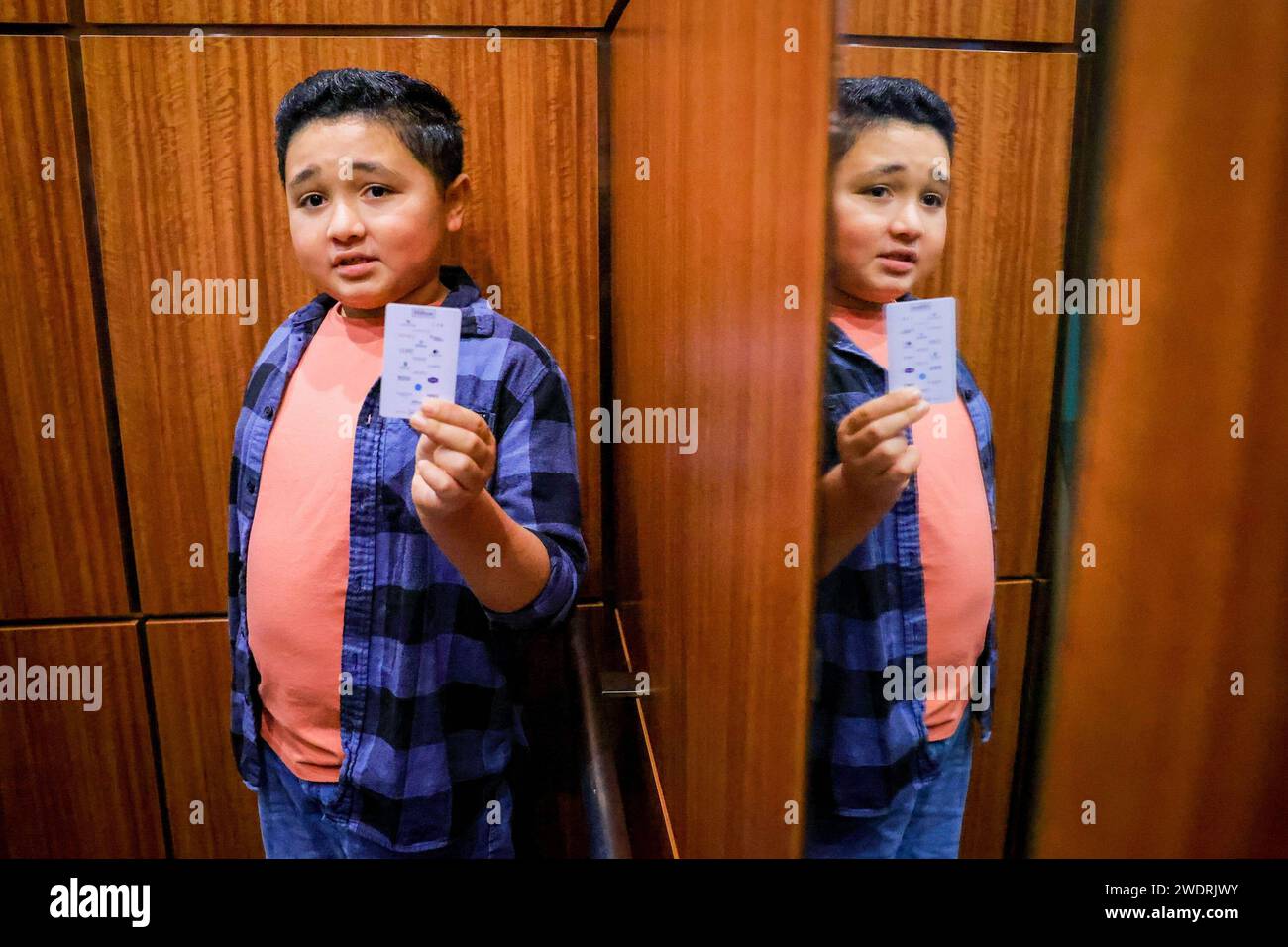 Concord, USA. 05th Jan, 2024. Eli German, a 10-year-old with autism, shows a hotel card as he takes the elevator to the seventh floor at the Hilton Hotel in Concord, California, on Jan. 5, 2024. German and his family of five have stayed in the hotel free of charge through the Concord's Practice Stay program, which serves traveling families with a loved one diagnosed with Autism Spectrum Disorders. (Photo by Ray Chavez/Bay Area News Group/TNS/Sipa USA) Credit: Sipa USA/Alamy Live News Stock Photo