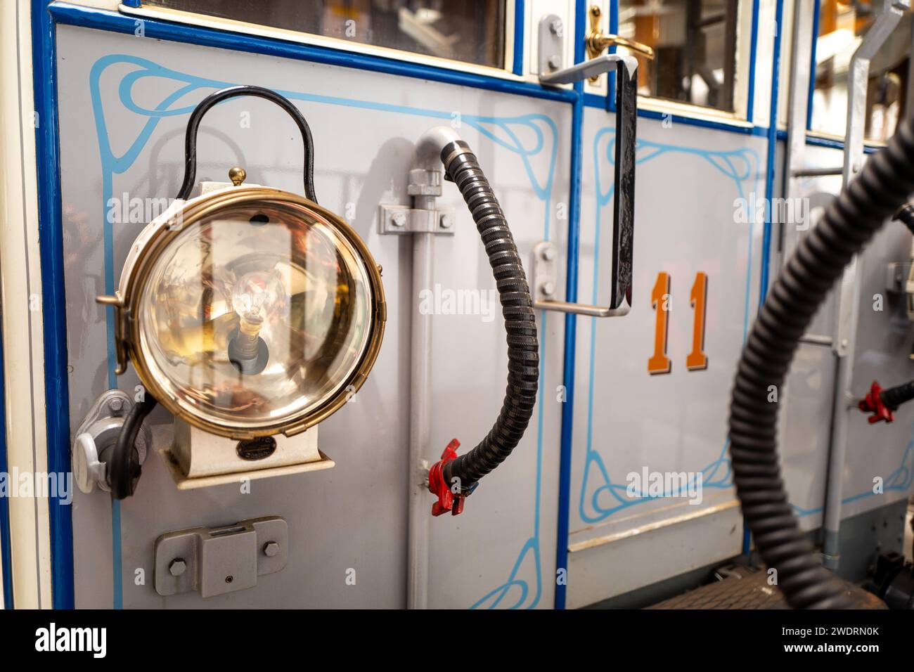 A lamp in a train with multiple pipes Stock Photo