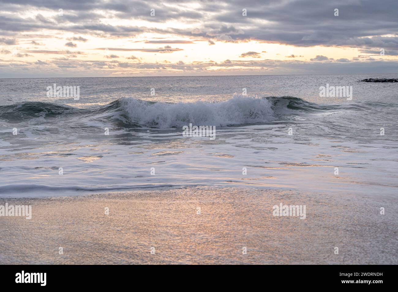 Atlantic Ocean waves crashing ashore onto the beach Stock Photo