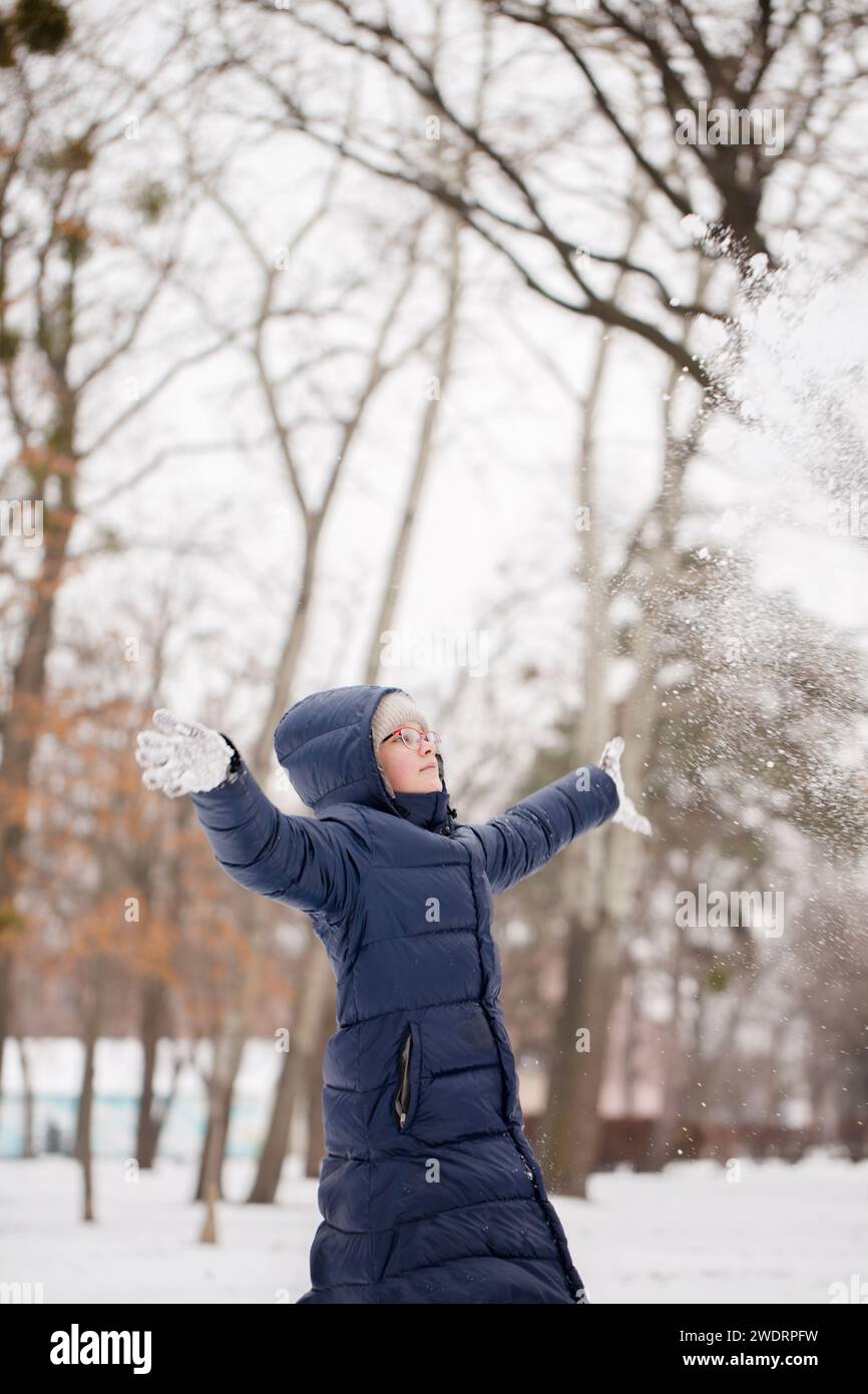 Teenage girl throws up snow Stock Photo Alamy
