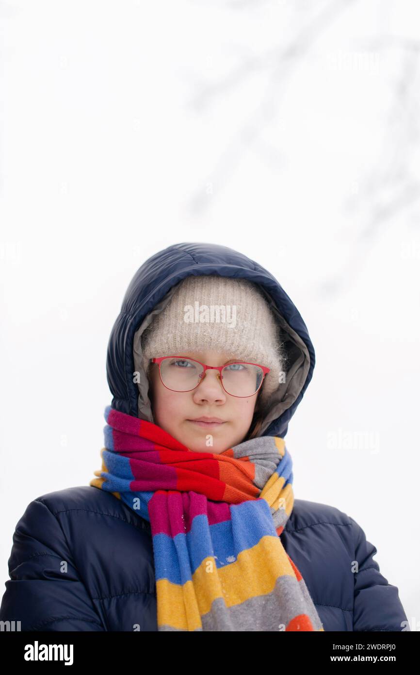 Winter portrait of a girl in a warm colored scarf Stock Photo