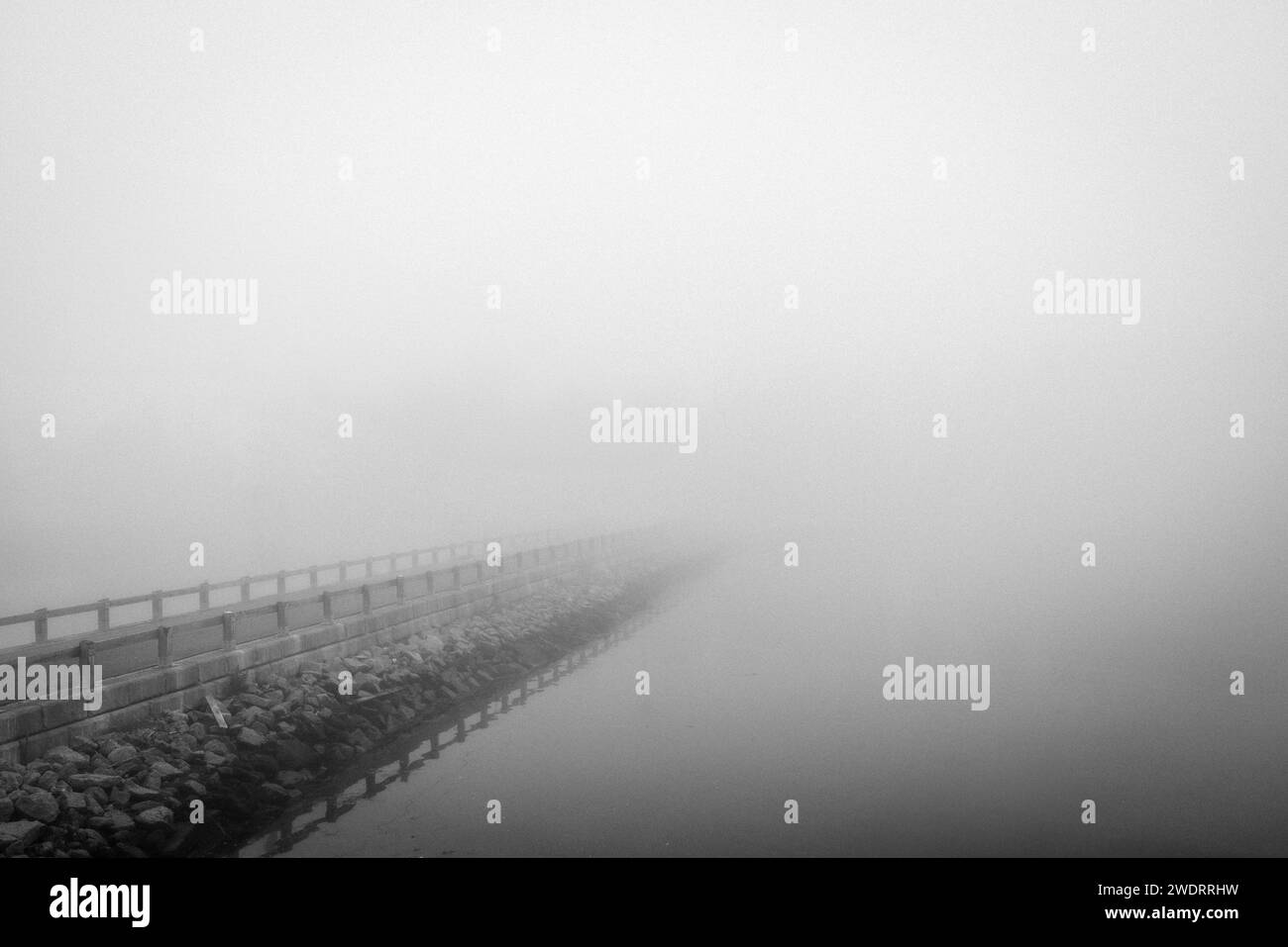 Road disappears into heavy fog, Stonington, Maine Stock Photo