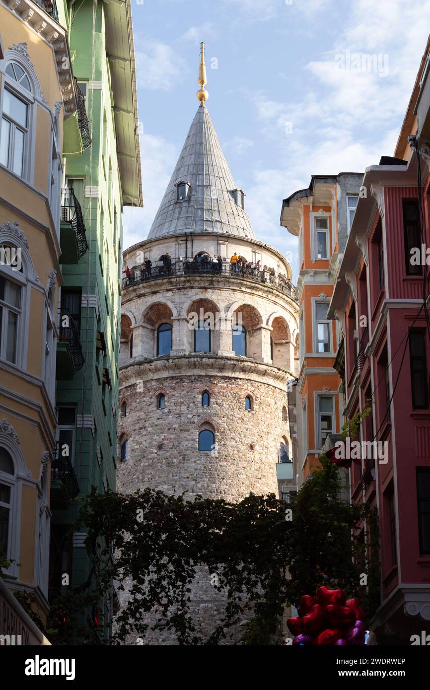 View of Galata Tower and colorful buildings underneath Stock Photo