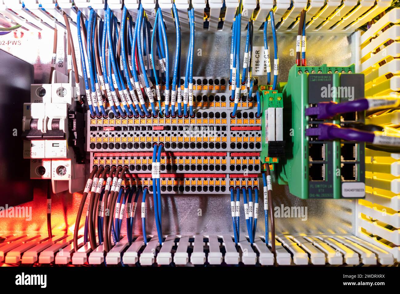Top down view of wires plugged into terminals with colored light Stock