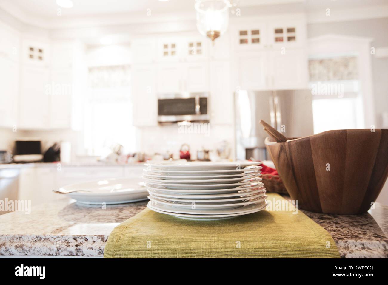 White Stacked Plates on Kitchen Counter Stock Photo - Alamy