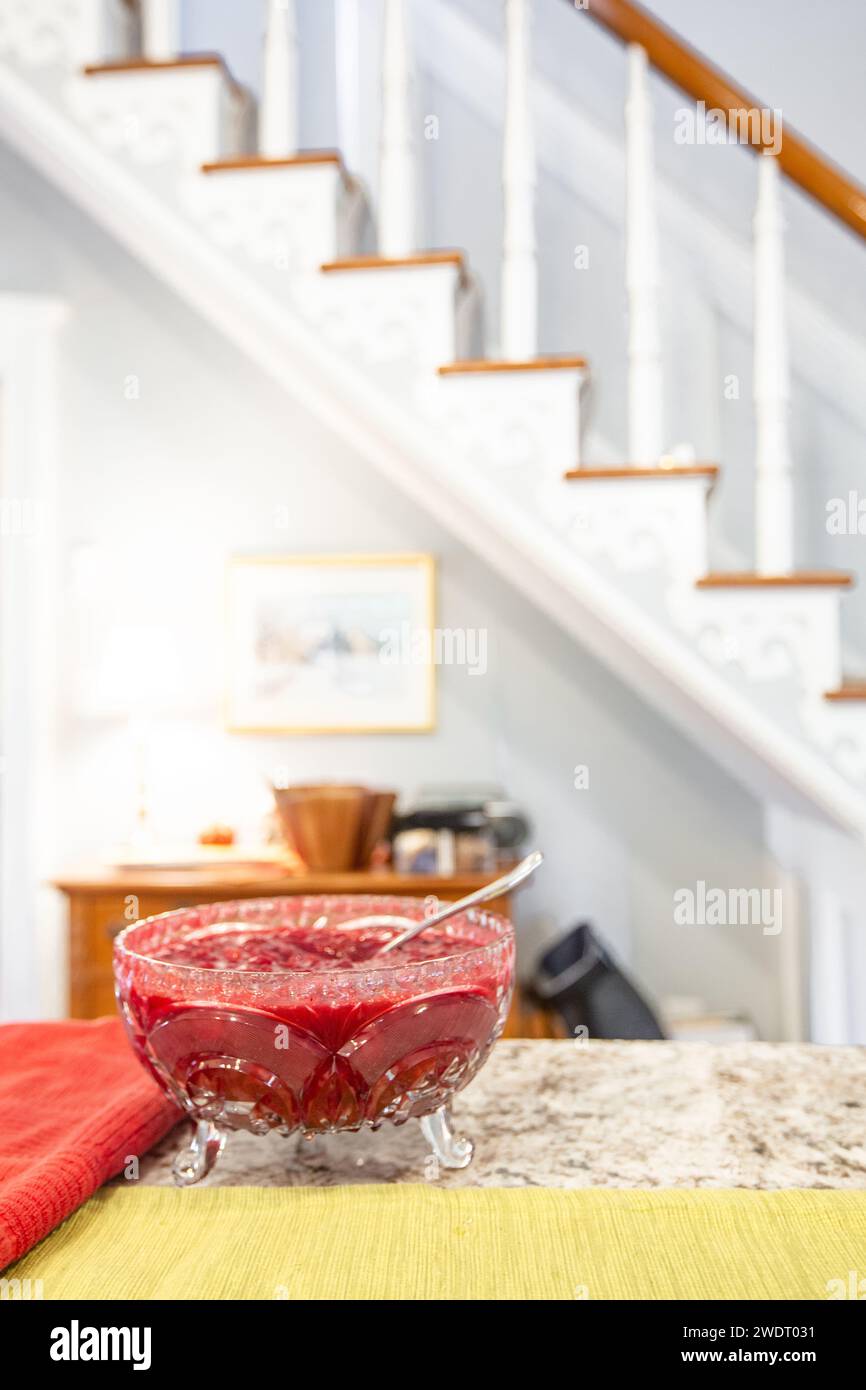 Red Cranberry Sauce in Glass Bowl on Kitchen Counter Stock Photo