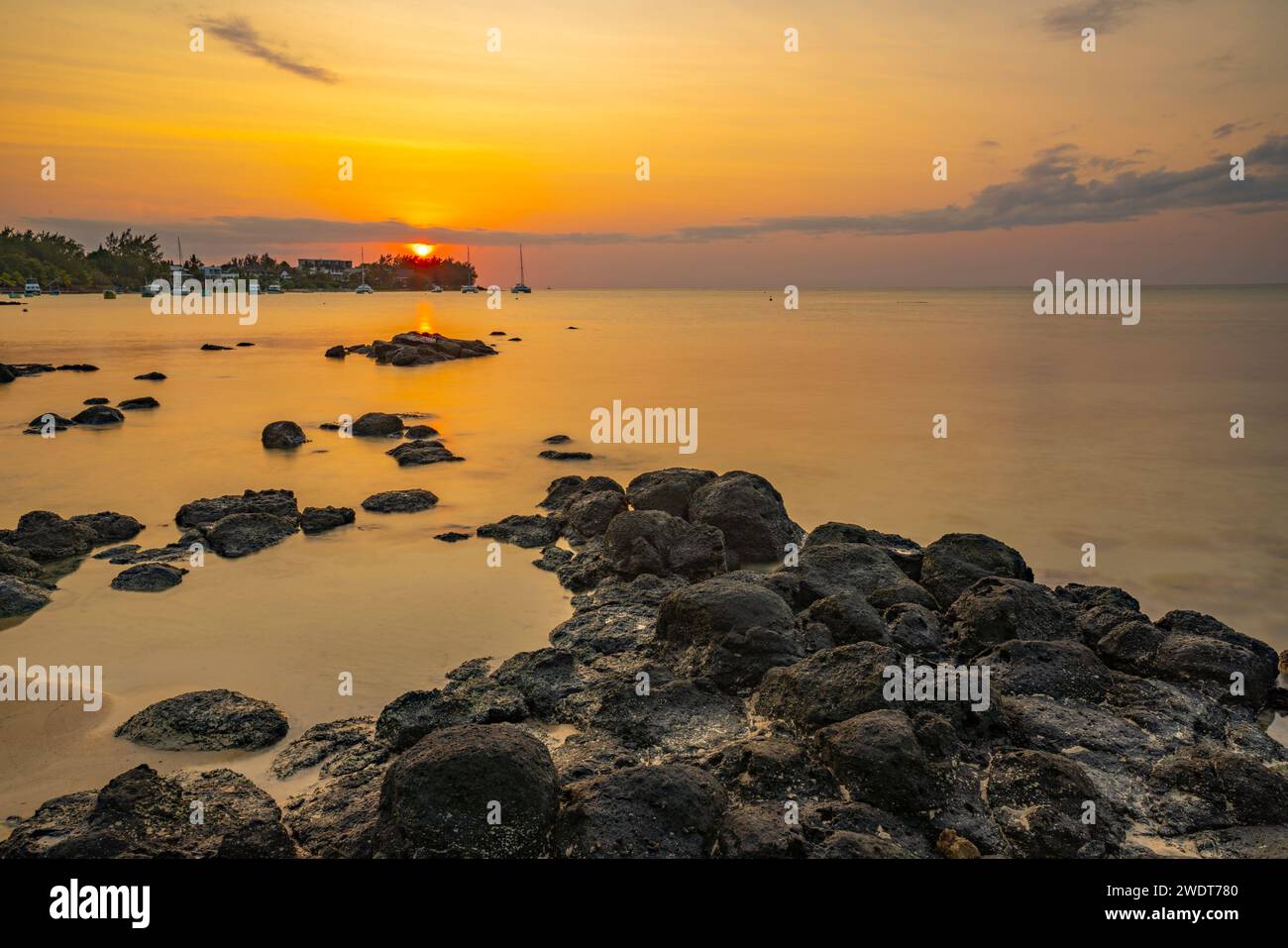 View of beach and Indian Ocean at sunset in Cap Malheureux, Mauritius, Indian Ocean, Africa Stock Photo