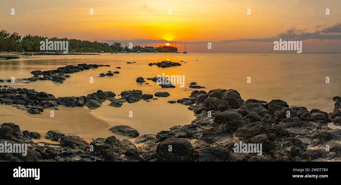 View of beach and Indian Ocean at sunset in Cap Malheureux, Mauritius, Indian Ocean, Africa Stock Photo