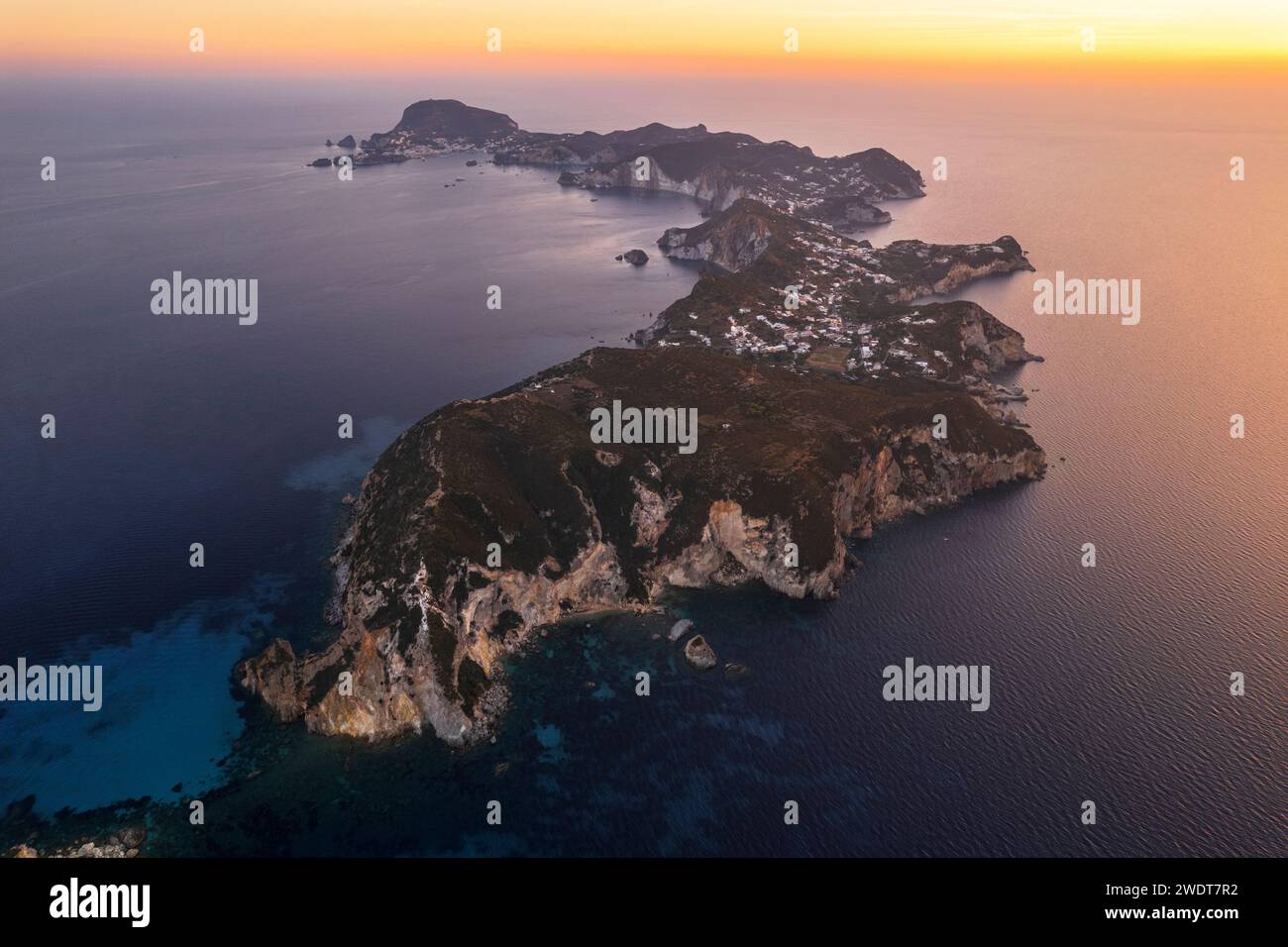 Aerial view of the island of Ponza with typical moon shape at dusk, Pontine archipelago, Latina province, Tyrrhenian Sea, Latium (Lazio), Italy Europe Stock Photo