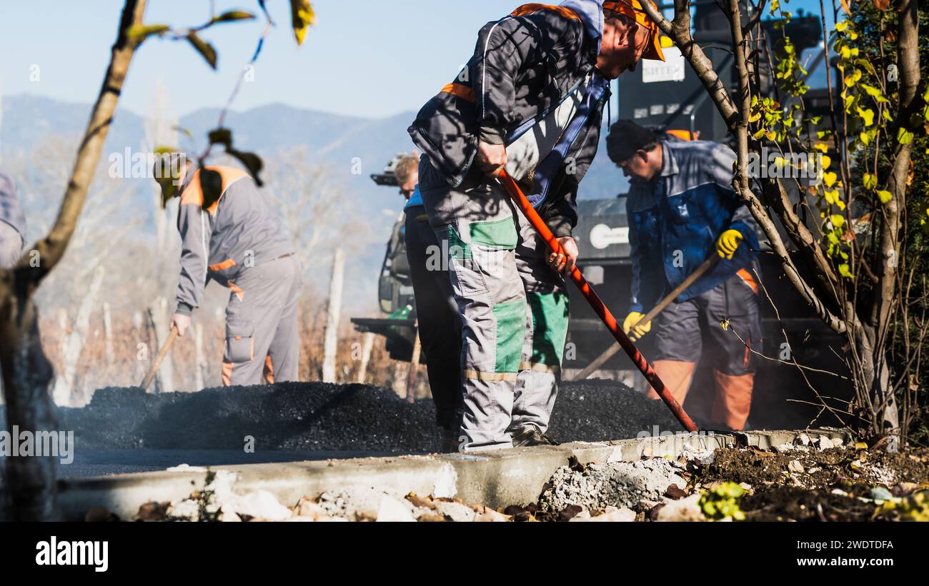 Road Construction Site Stock Photos, Laying new asphalt surface, Heavy duty Machine's
