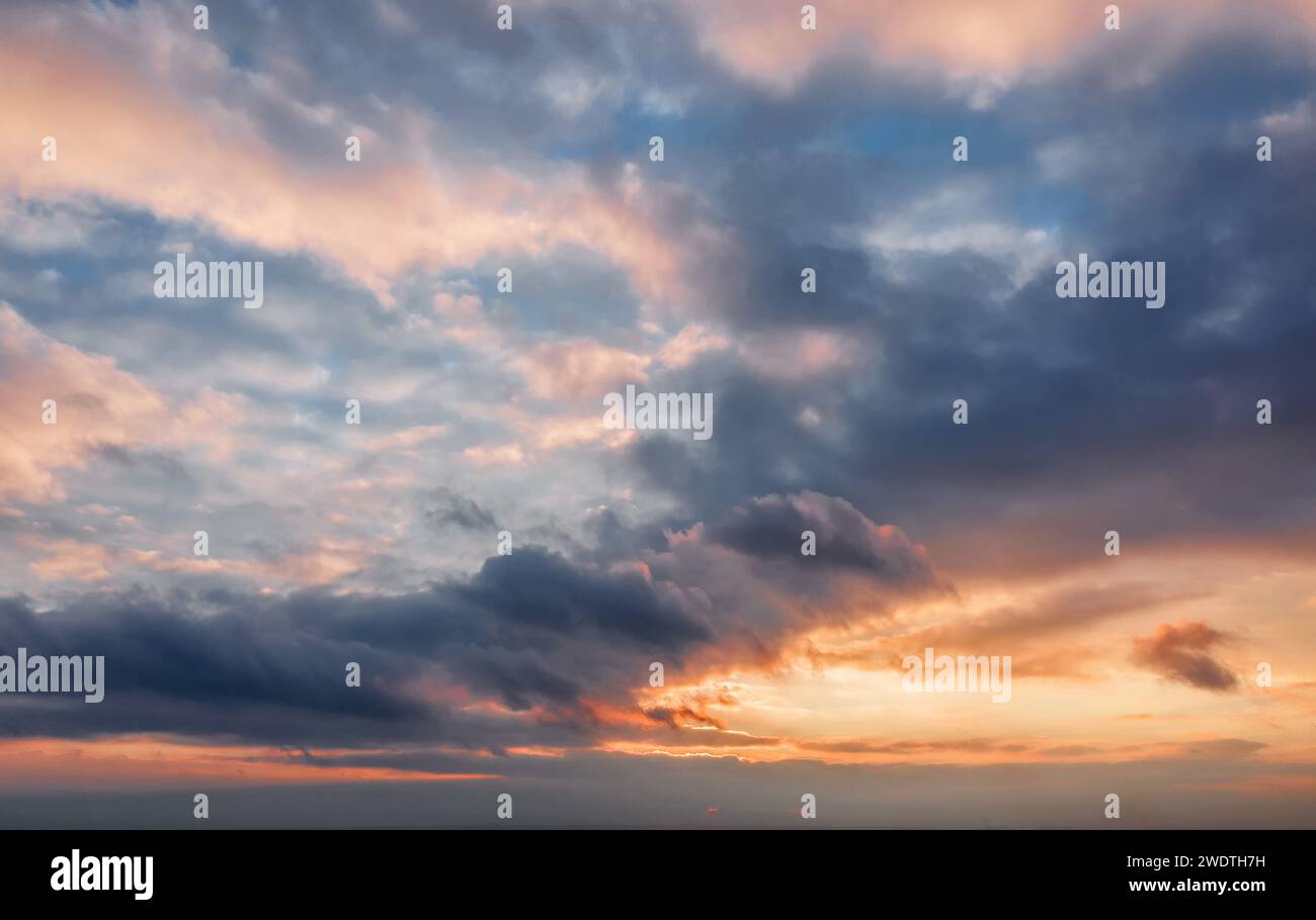 Beautiful sunset sky background with clouds. Stock Photo