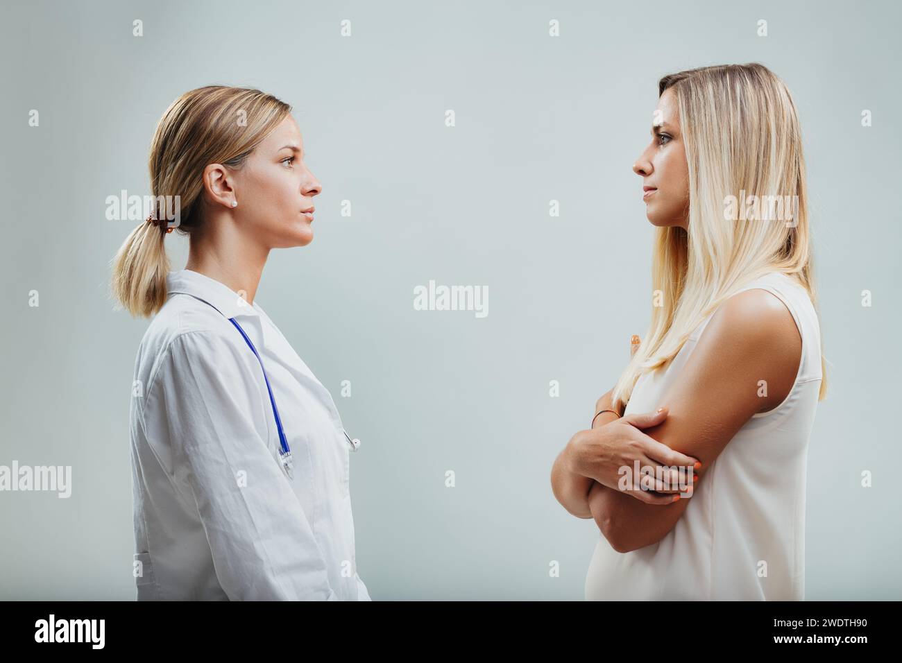 Doctor and patient share a moment of empathy, the doctor's presence providing silent solace Stock Photo