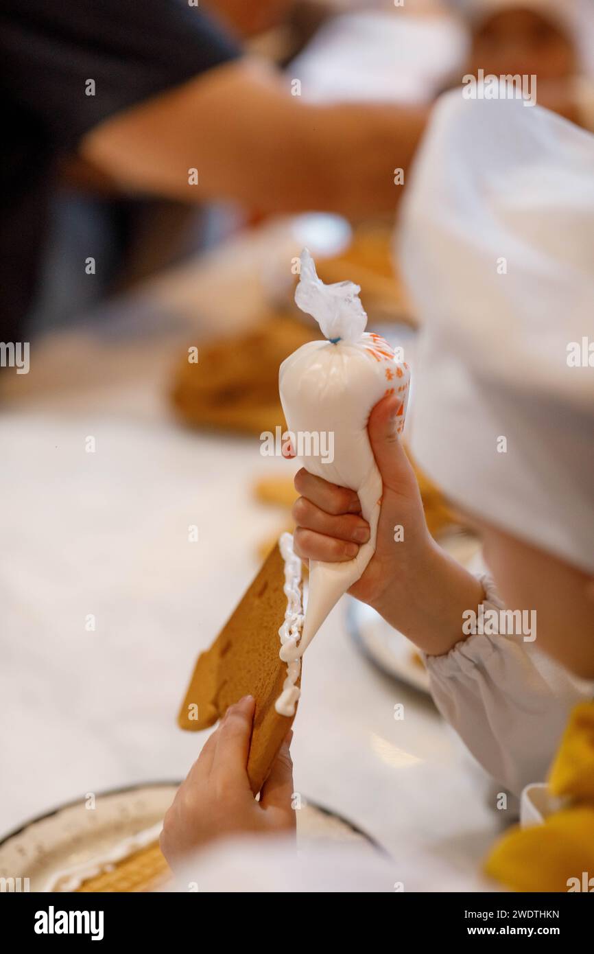 Child hands decorating cake hi-res stock photography and images - Alamy