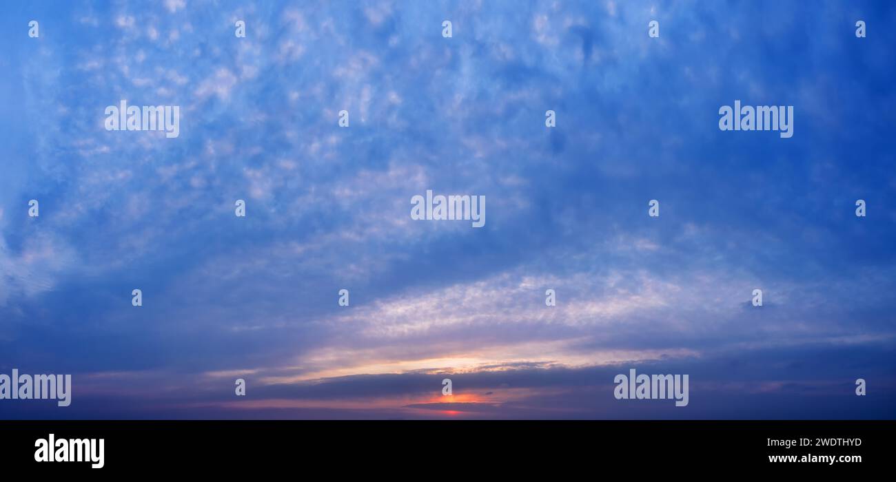 Beautiful colorful sunset sky with clouds. Stock Photo