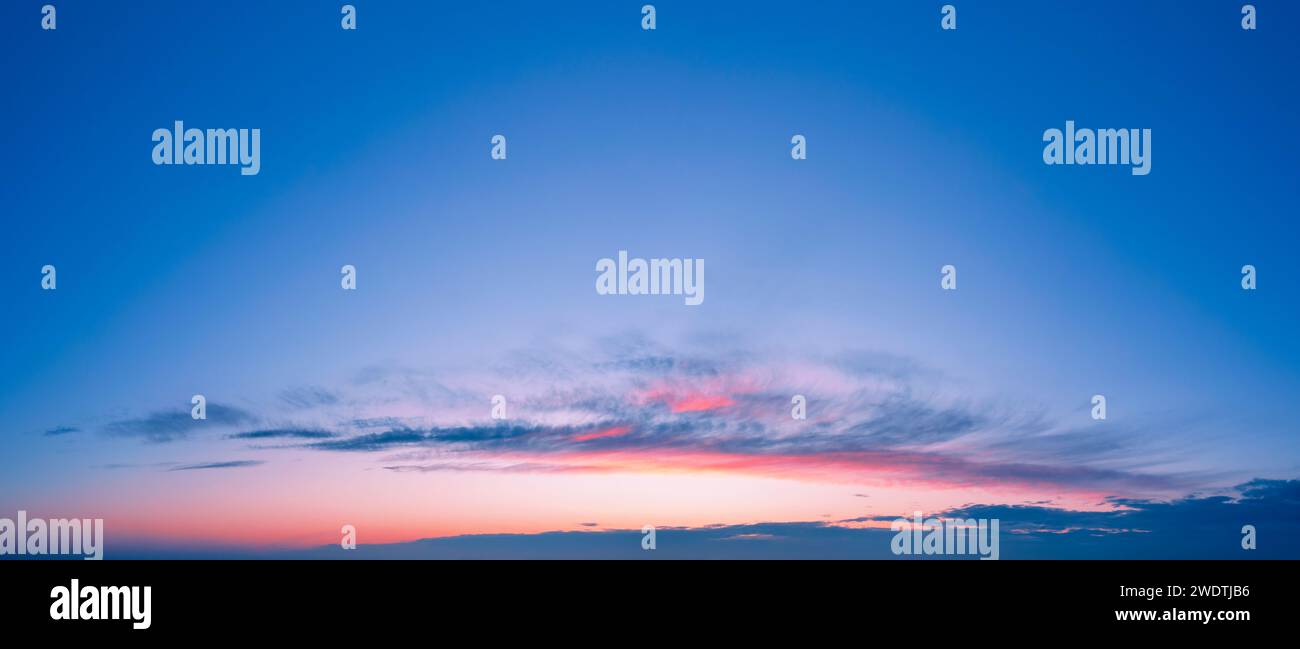 Romantic sunset sky background with beautiful clouds Stock Photo - Alamy