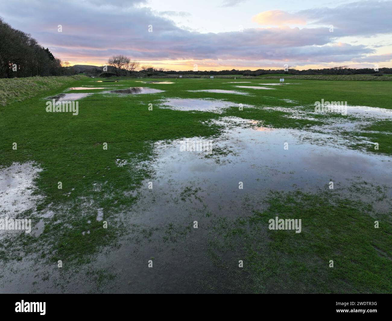 The view of a flooded golf course with waterlogged grass Stock Photo