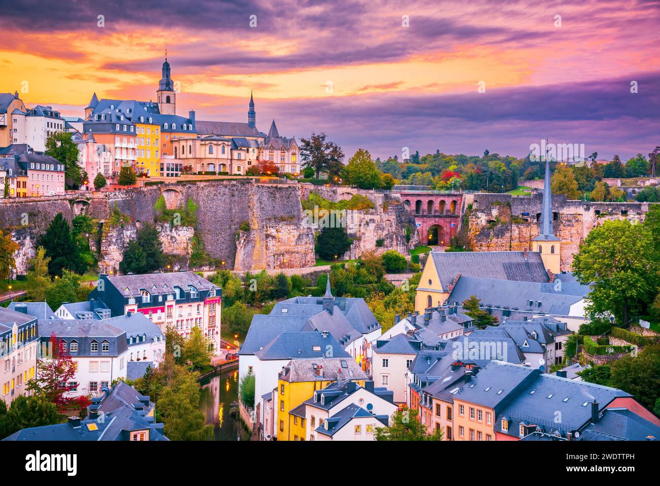 Luxembourg City, twilight scenic with old town, Alzette River, beautiful colored sky clouds. Stock Photo