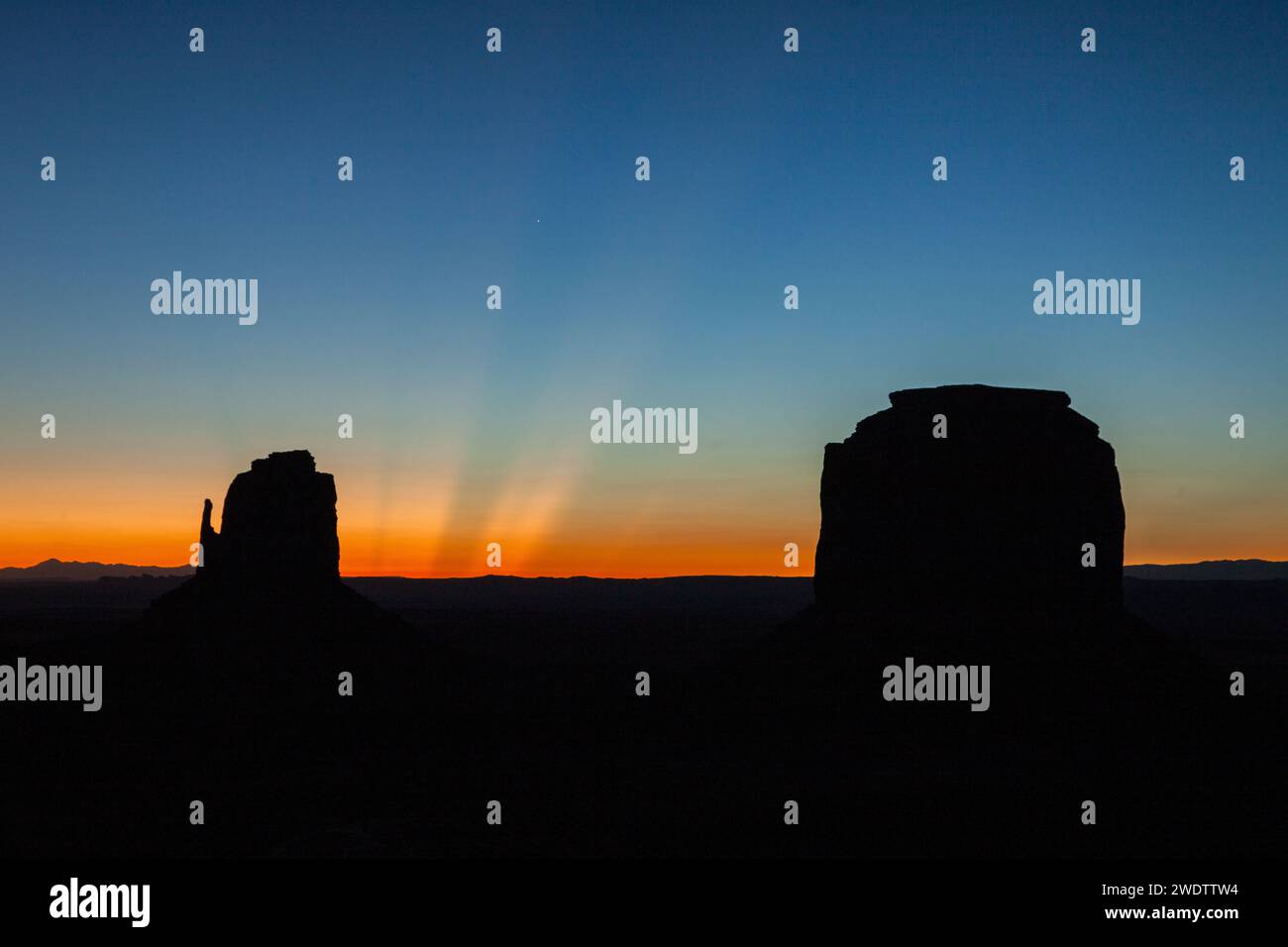 Crepuscular sun rays over the East Mitten & Merrick Butte before dawn ...