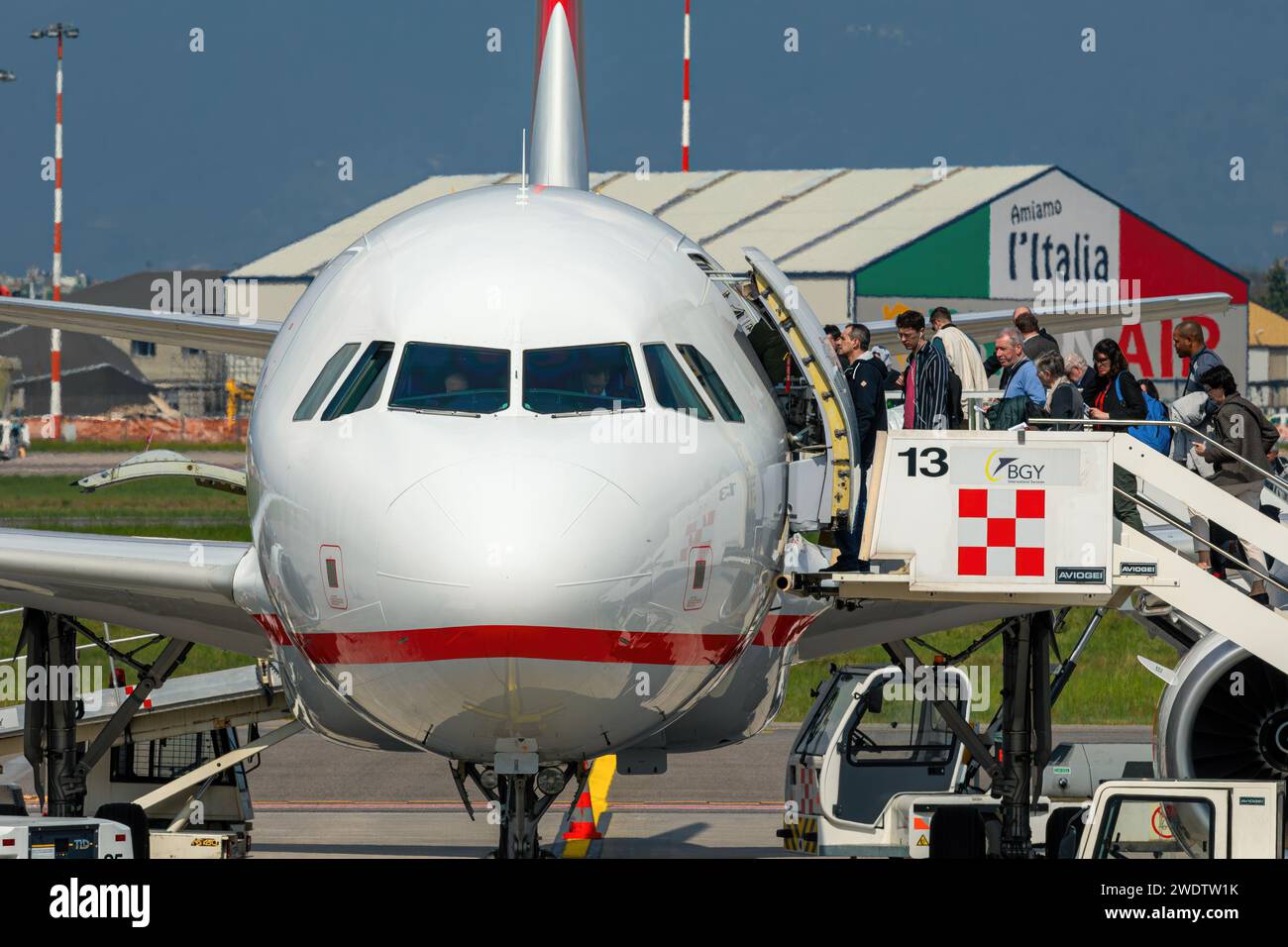 People boarding airplane at Orio Al Serio Airport near Bergamo, Italy. Stock Photo