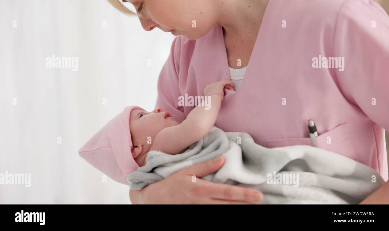 Nurse holding babies hi-res stock photography and images - Alamy