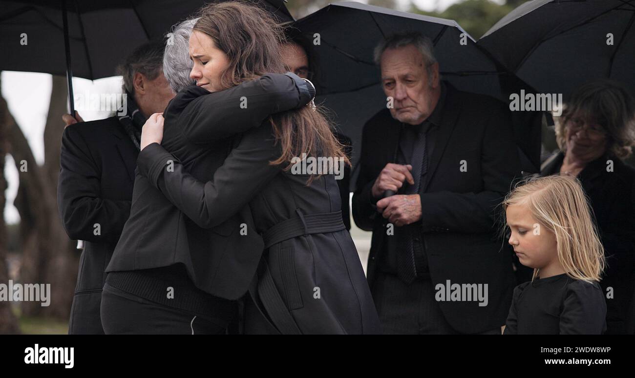 Funeral, crying family and people hug for grief support, mourning ...