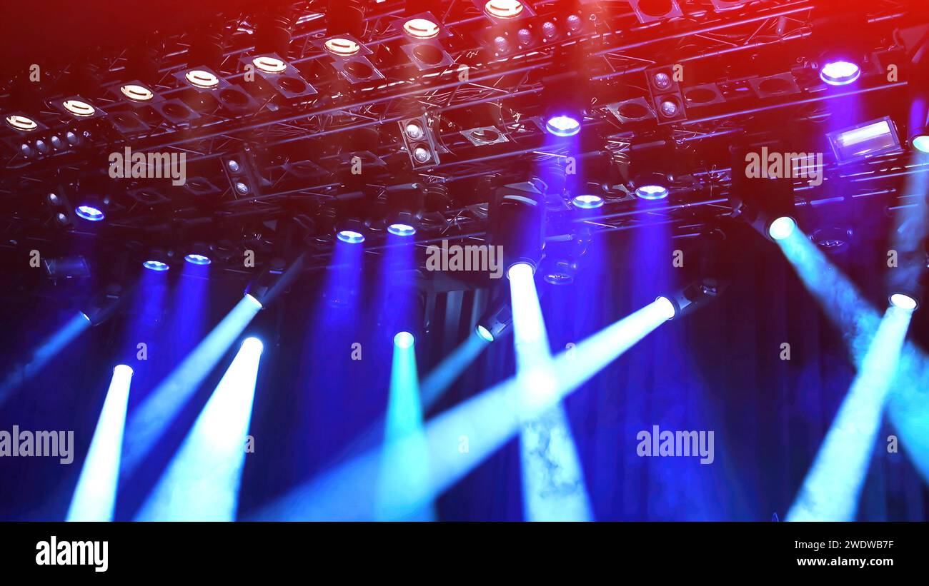 blue Lightning from the spotlights during the show or musical concert Stock Photo