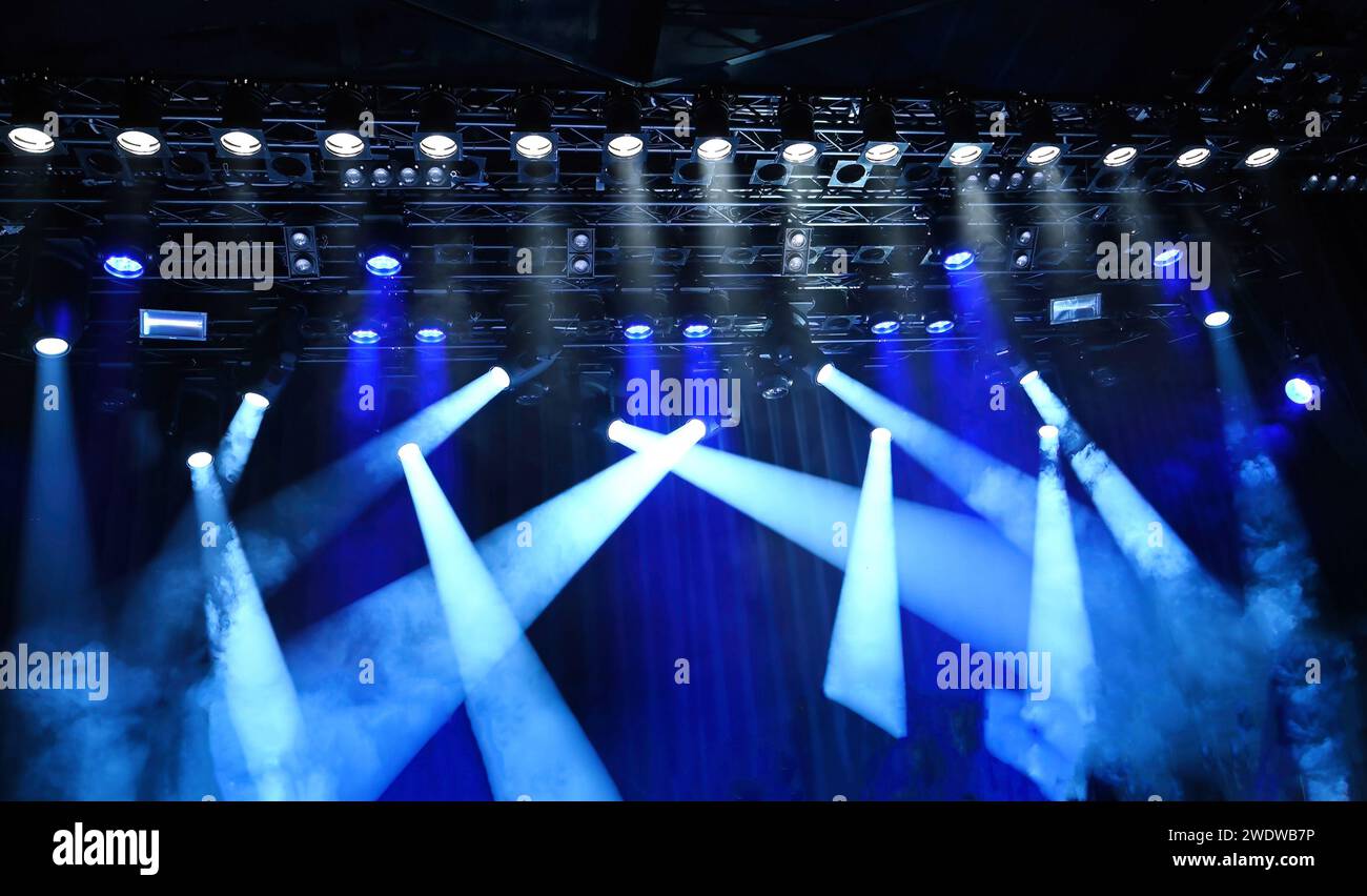 stage ceiling light, bright blue spotlights on a musical stage Stock Photo