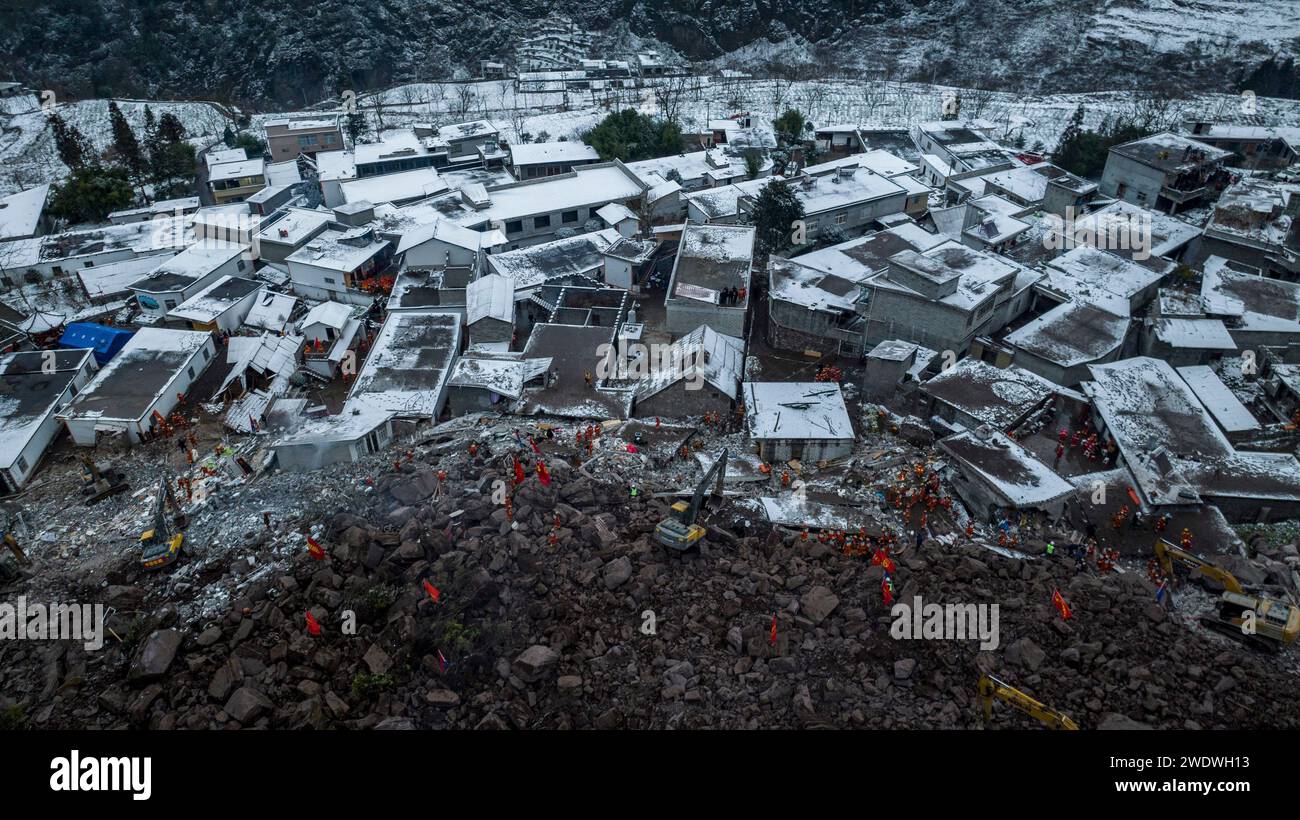 Tangfang Town, China. 22nd Jan, 2024. An aerial drone photo taken on Jan. 22, 2024 shows rescuers working at the site of a landslide in Liangshui Village, Tangfang Town in the city of Zhaotong, southwest China's Yunnan Province. China's Ministry of Emergency Management has upgraded the emergency response level to the second-highest level for the landslide that struck southwestern Yunnan Province early Monday. The ministry has dispatched work teams to the disaster-hit area to guide the rescue and relief work. The landslide hit Liangshui Village in the city of Zhaotong in Yunnan Pr Credit: Xinhu Stock Photo