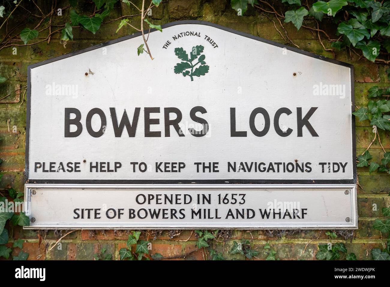 National Trust sign at Bowers Lock on the River Wey Navigations near Guildford, Surrey, England, UK Stock Photo