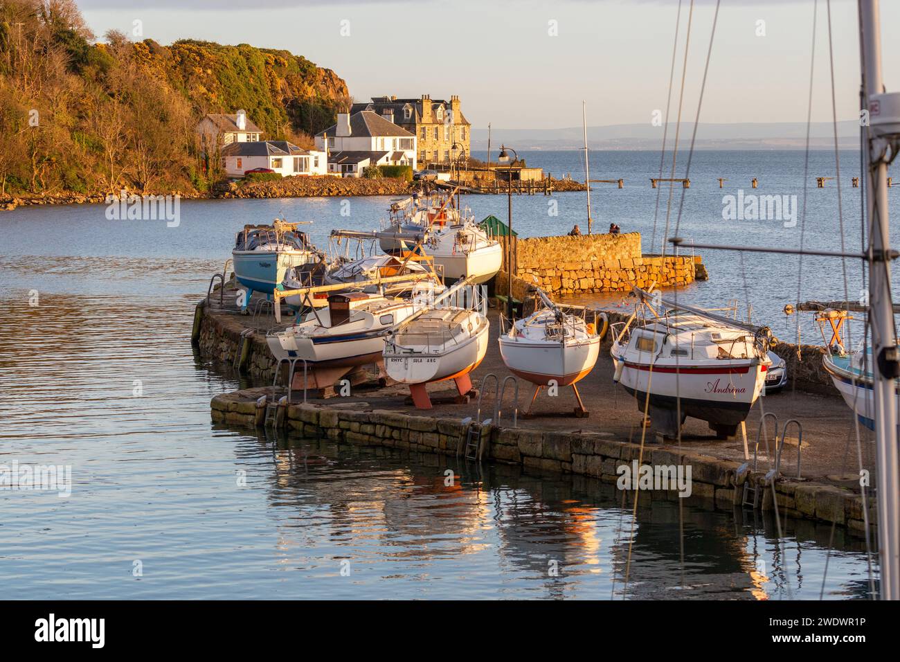 Yachts on the seawall in Aberdour Fife Stock Photo