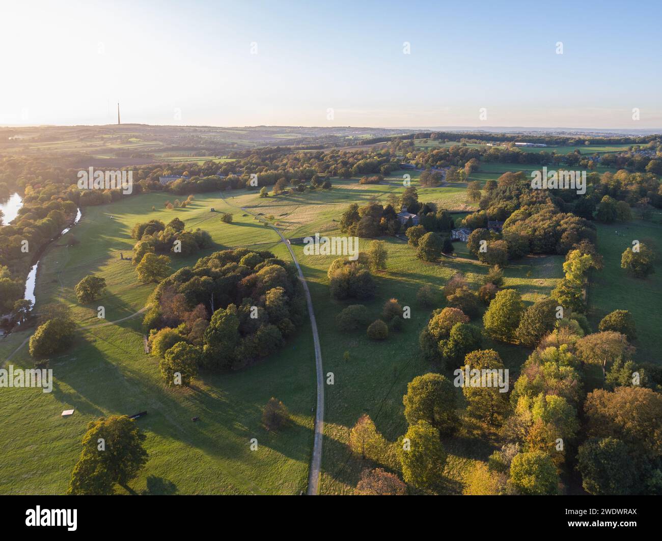 Aerial view over Yorkshire Sculpture Park, UK and into the countryside on a beautiful sunny evening with Emley Moor Tower in the distance Stock Photo