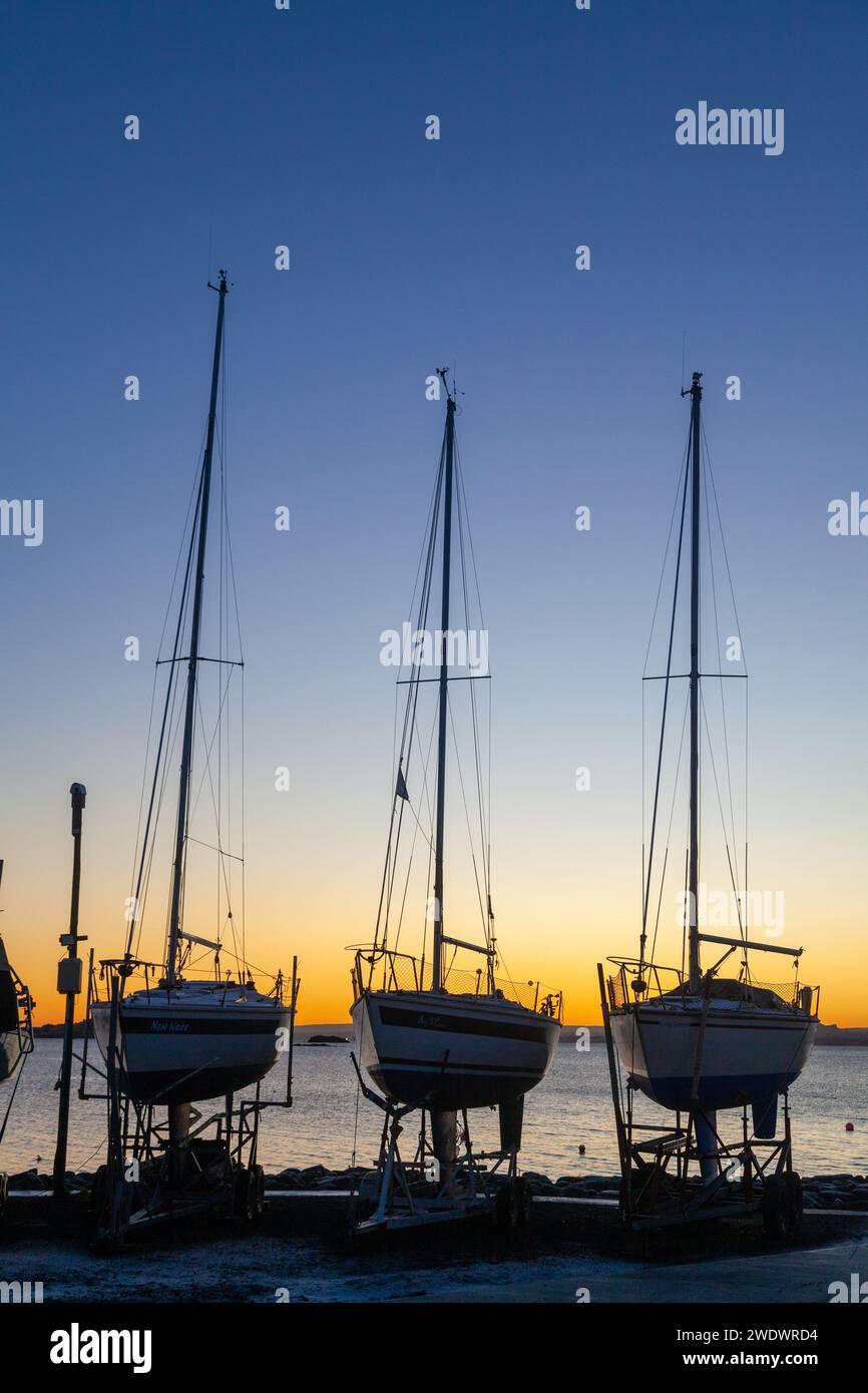 Yachts out of the water in Dalgety Bay sailing club at sunrise Stock