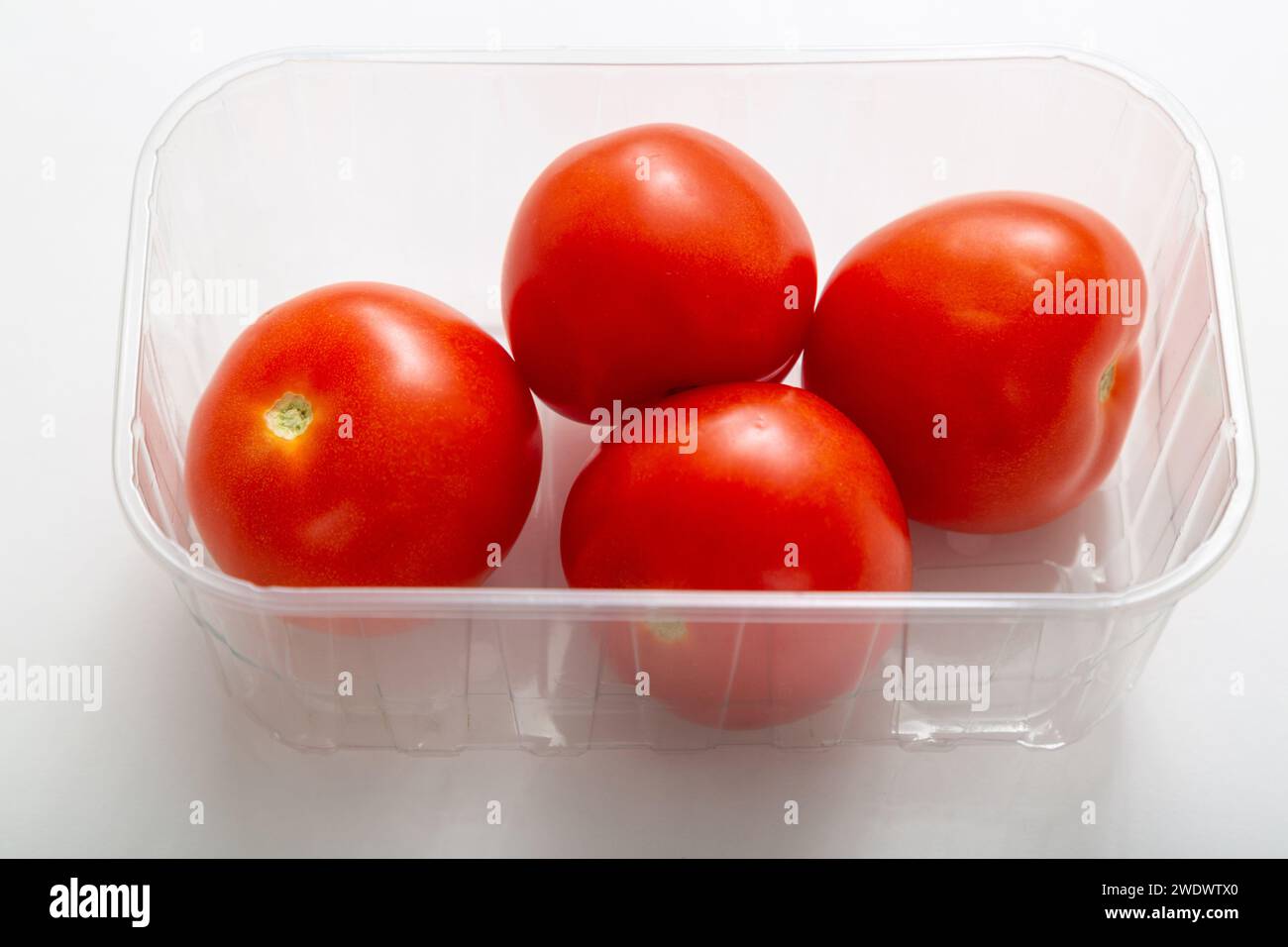 salad tomatoes in plastic punnet Stock Photo