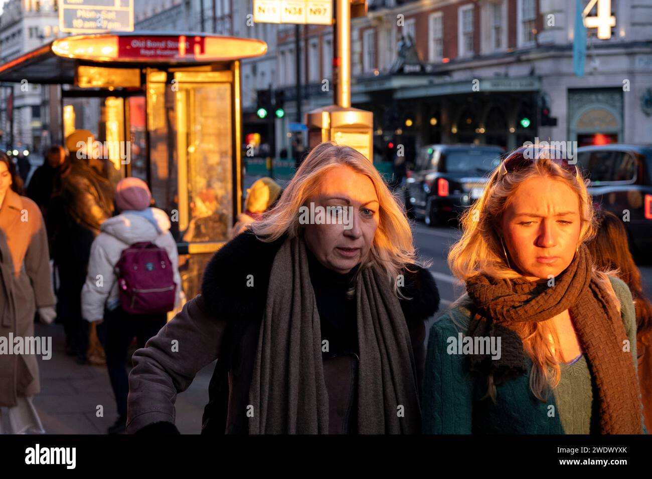 Late afternoon light illuminating people walking along Piccadilly on 19th January 2024 in London, United Kingdom. Stock Photo