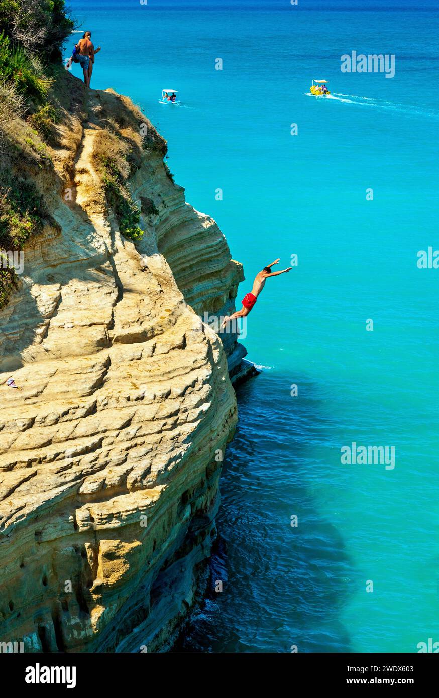 Cliff diving at 'Canal d' Amour' beach, Sidari town, Kerkyra ('Corfu') island, Ionian Sea, Greece Stock Photo