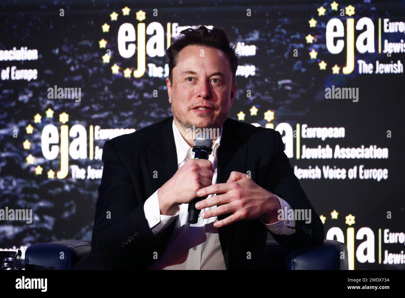 Krakow, Poland. 22nd Jan, 2024. Elon Musk, owner of Tesla and the X (formerly Twitter) platform, speaks during a symposium on fighting antisemitism titled 'Never Again : Lip Service or Deep Conversation' in Krakow, Poland on January 22nd, 2024. Musk, who was invited to Poland by the European Jewish Association (EJA) has visited the Auschwitz-Birkenau concentration camp earlier that day, ahead of International Holocaust Remembrance Day. Credit: ZUMA Press, Inc./Alamy Live News Stock Photo