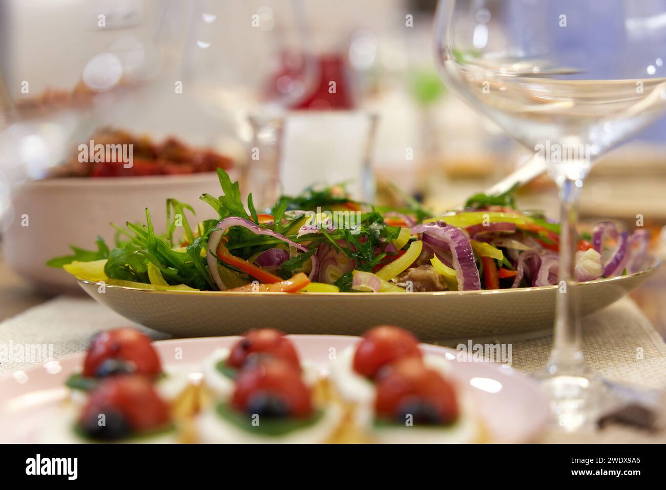 Lady bug cracker with cream cheese and tomato on festive table Stock Photo