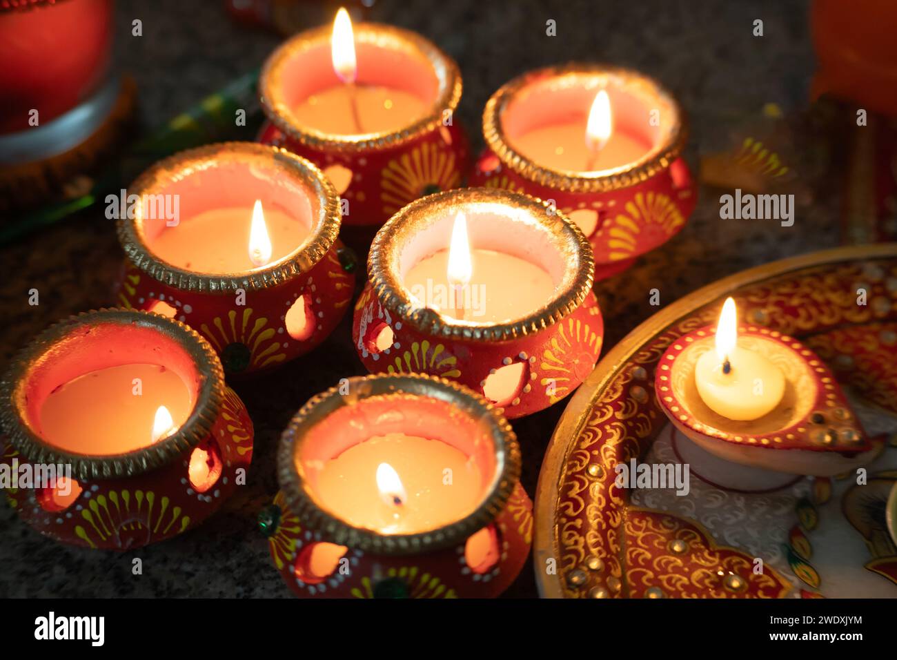 beautifully decorated diyas lit on the eve of diwali and the Ram temple ...