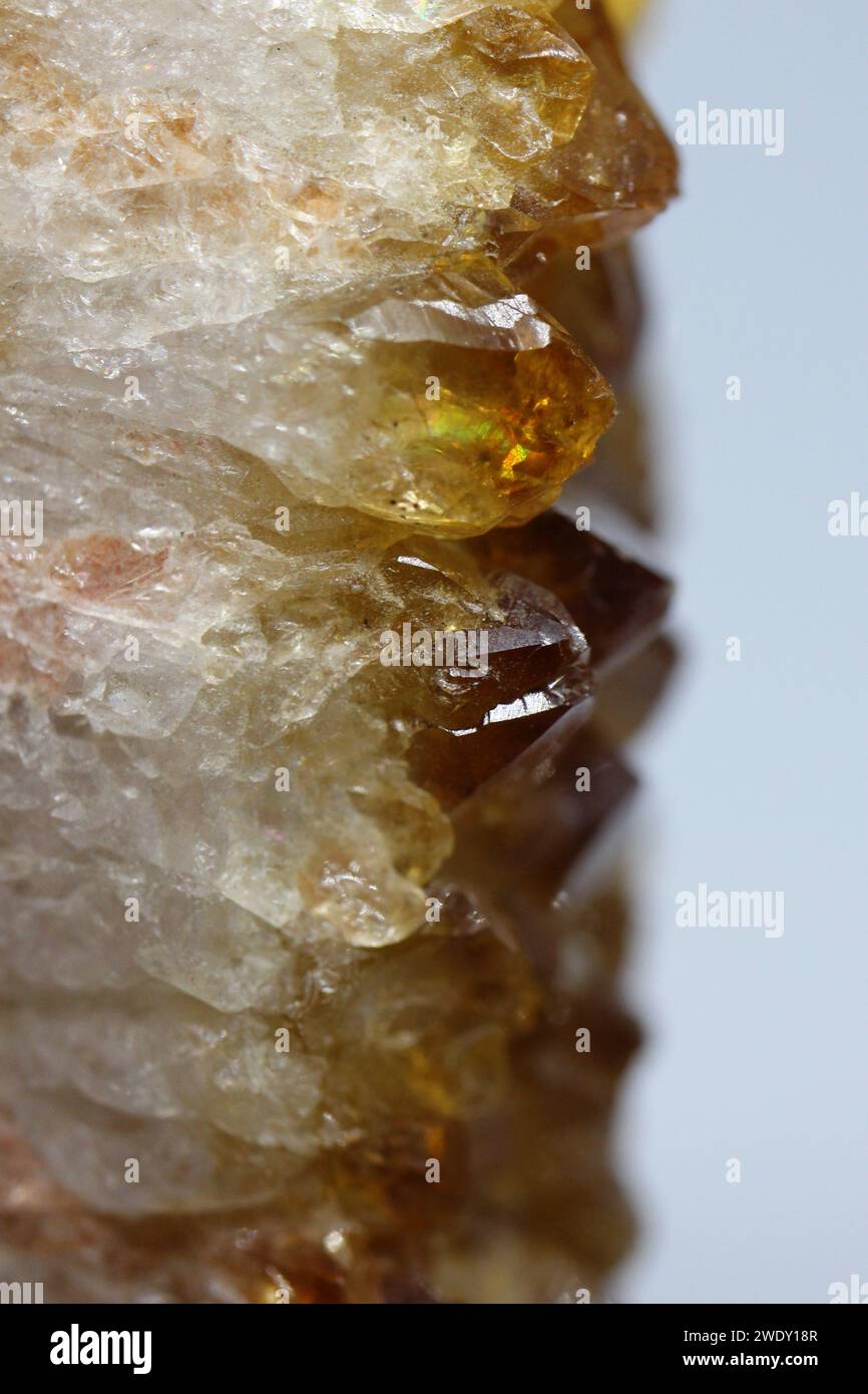 Close up on a citrine quartz stone's crystals. Macrophotography of a beautiful orange mineral gemstone from Brazil. Stock Photo