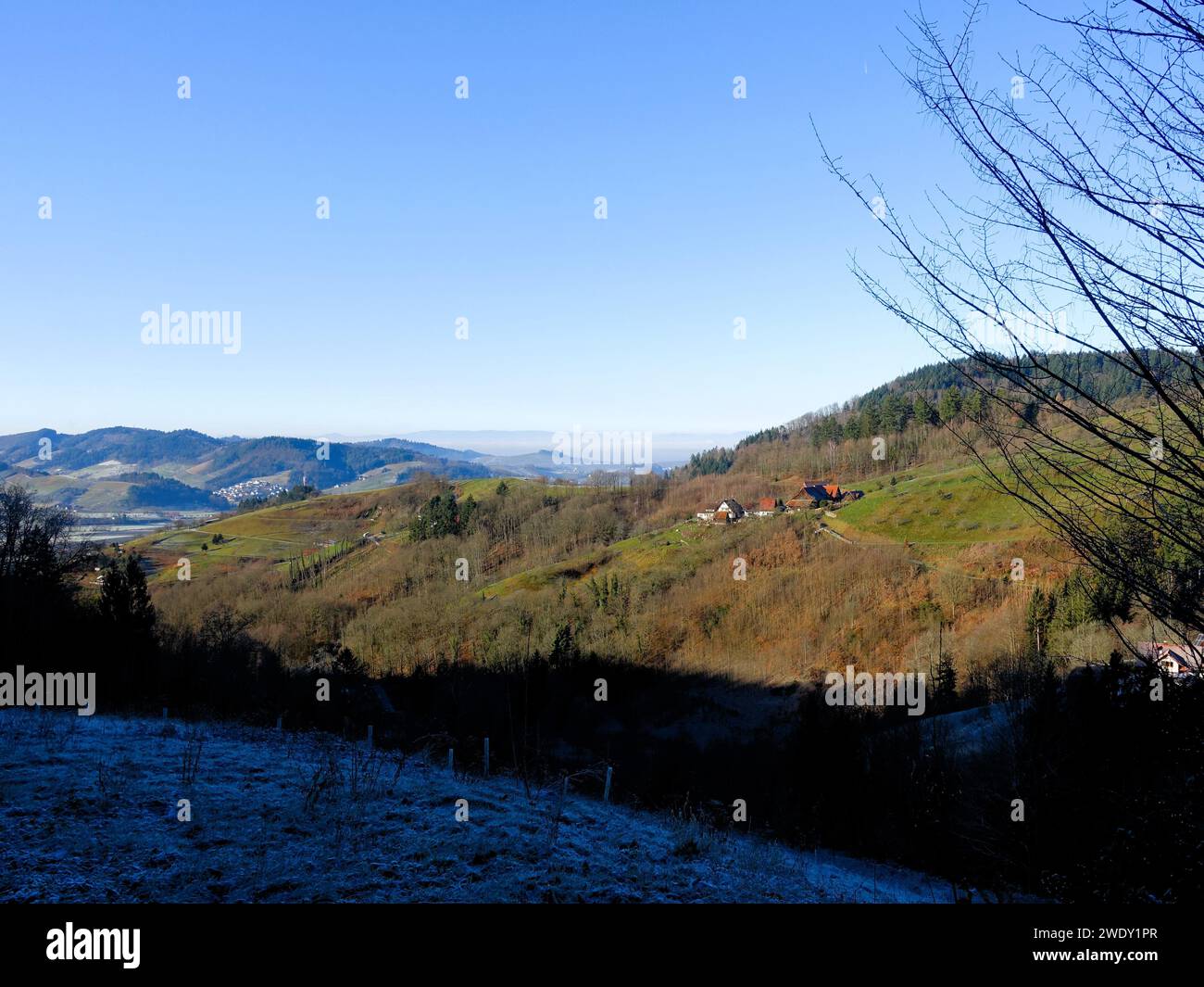 Clear day with stunning mountain views and vibrant blue sky, offering