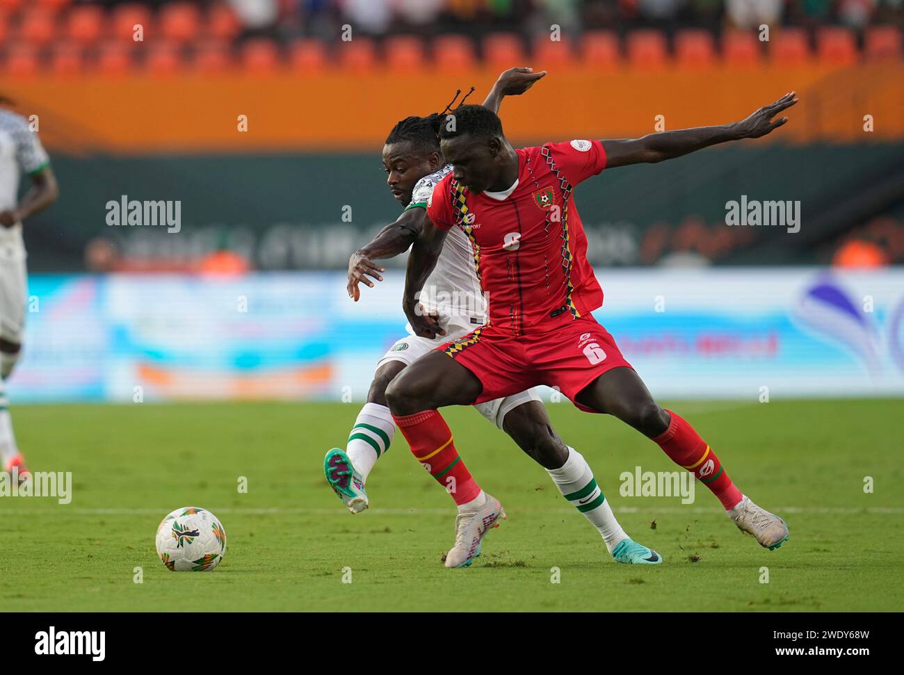 Abidjan, Ivory Coast. January 22 2024: Moses Daddy Simon (Nigeria) and Fernando De Lacerda Gomes (Guinea Bissau) battle for the ball during a African Cup of Nations Group A game, Nigeria vs Guinea-Bissau, at Stade Felix Houphouet-Boigny, Abidjan, Ivory Coast. Kim Price/CSM Credit: Cal Sport Media/Alamy Live News Stock Photo