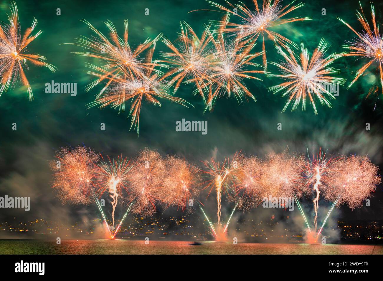 Fireworks over the Lake Zurich at the beginning of new year 2024 in Zurich, Switzerland. Stock Photo