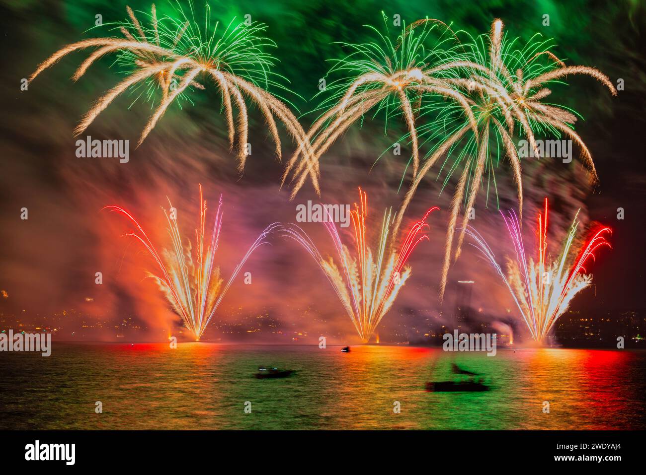 Fireworks over the Lake Zurich at the beginning of new year 2024 in Zurich, Switzerland. Stock Photo