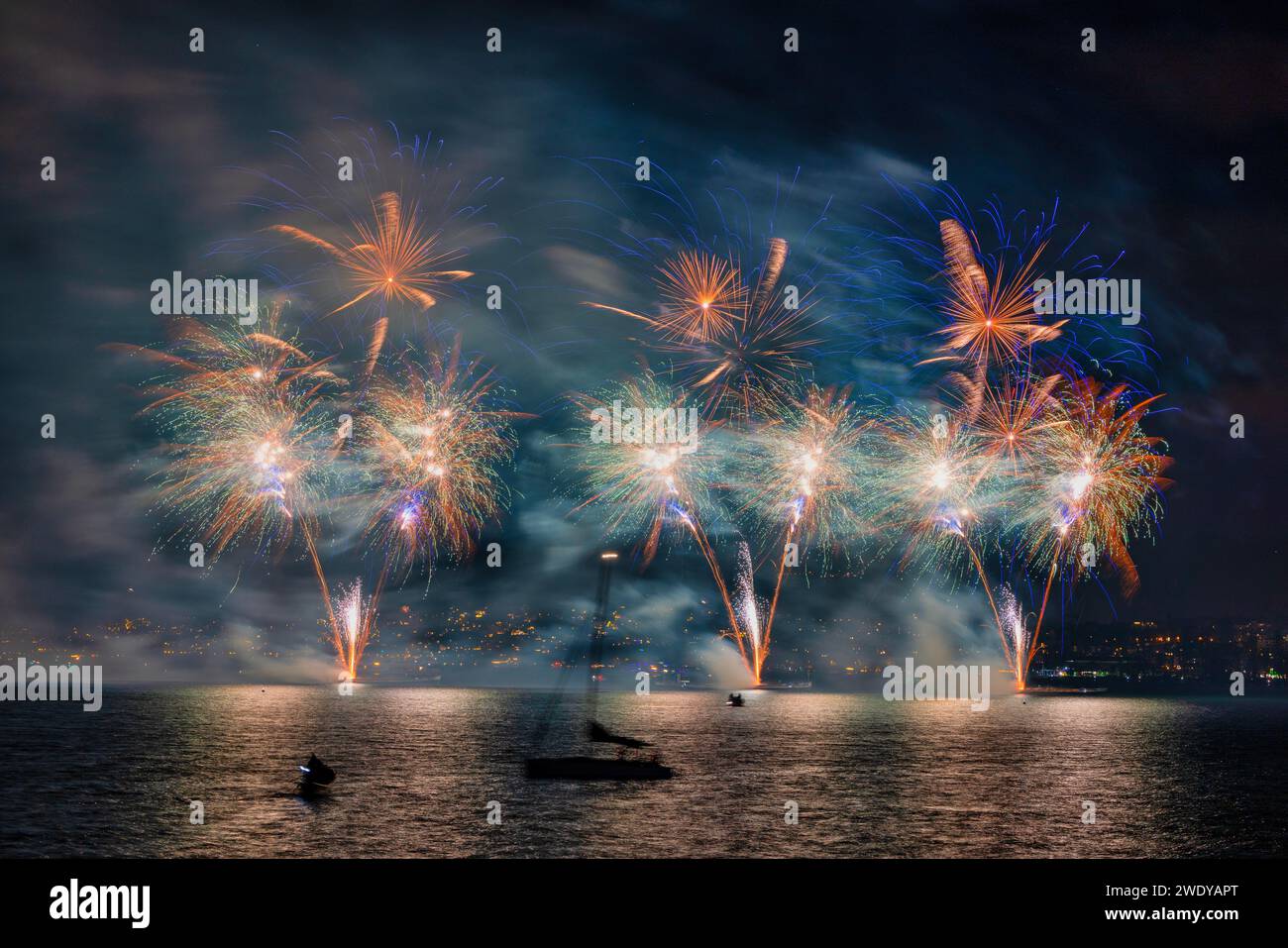 Fireworks over the Lake Zurich at the beginning of new year 2024 in Zurich, Switzerland. Stock Photo