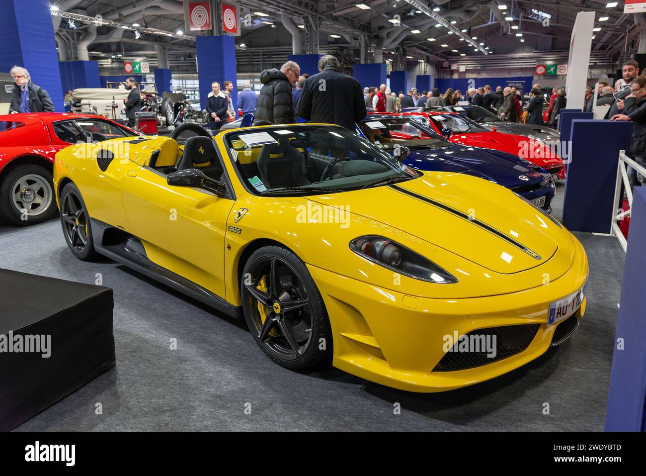 Paris, France - Rétromobile 2020. Focus on a Giallo Modena 2009 Ferrari Scuderia Spider 16M. Chassis no. 169860. Stock Photo