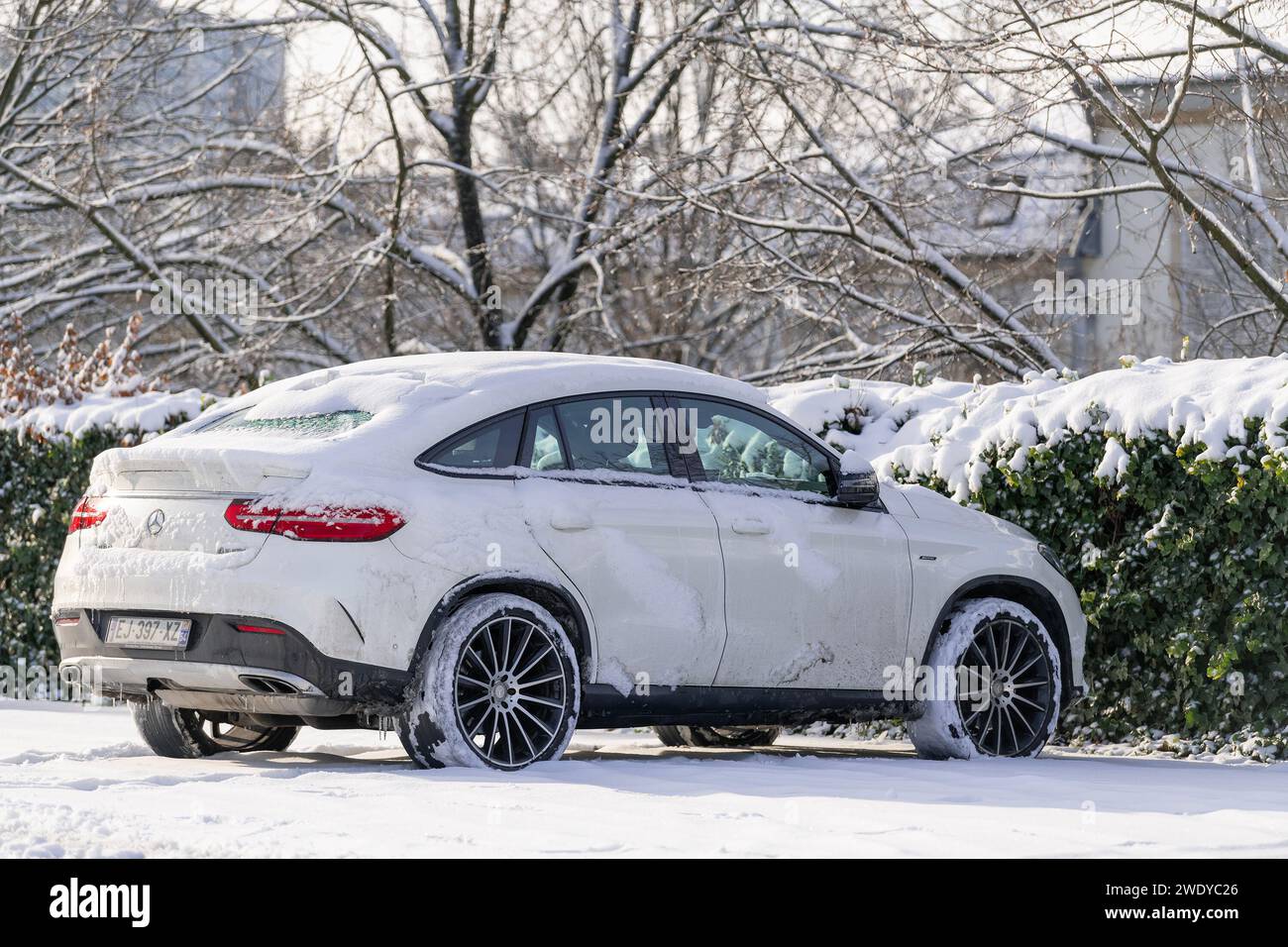 Nancy, France - White Mercedes-Benz GLE Coupé parked on the street with snow. Stock Photo