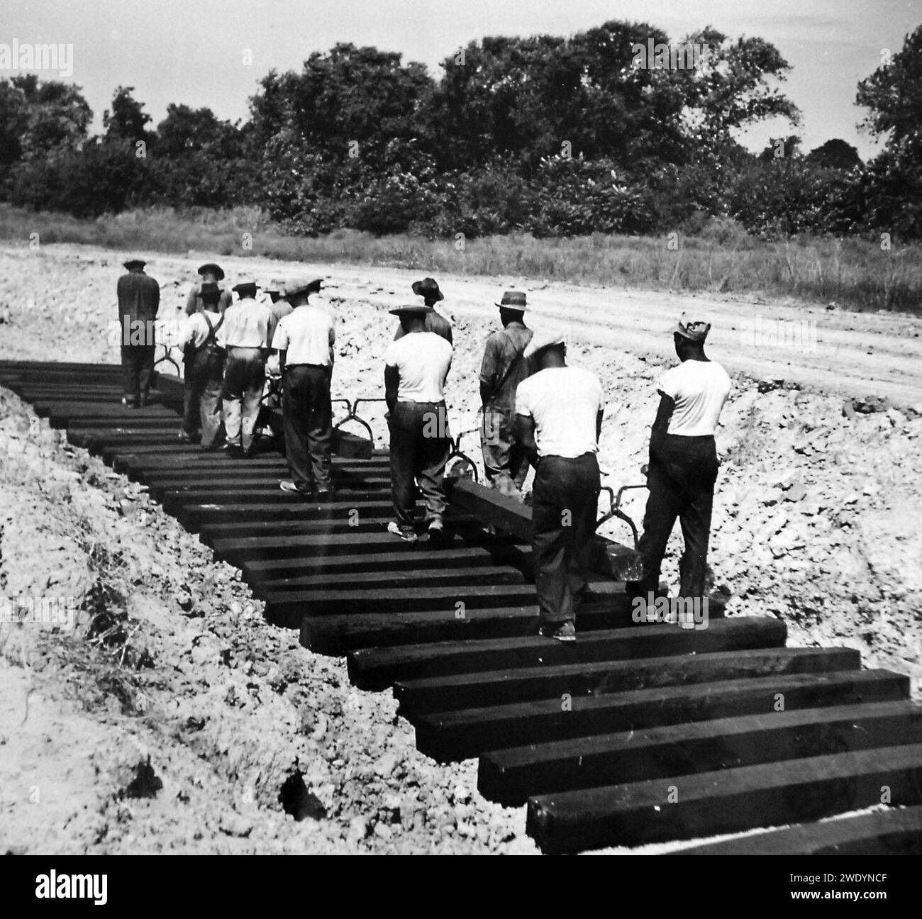 AfricanAmerican workers laying railroad ties for spur line, 1942