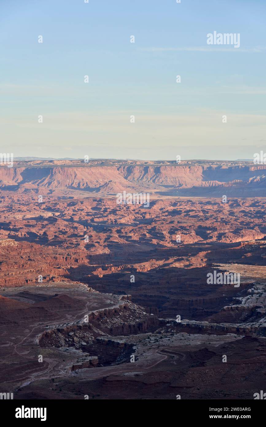 Evening draws in over Canyonlands National Park. The rock surface has been sculpted by the Colorado river, leaving steep cliffs and beautiful contrast Stock Photo