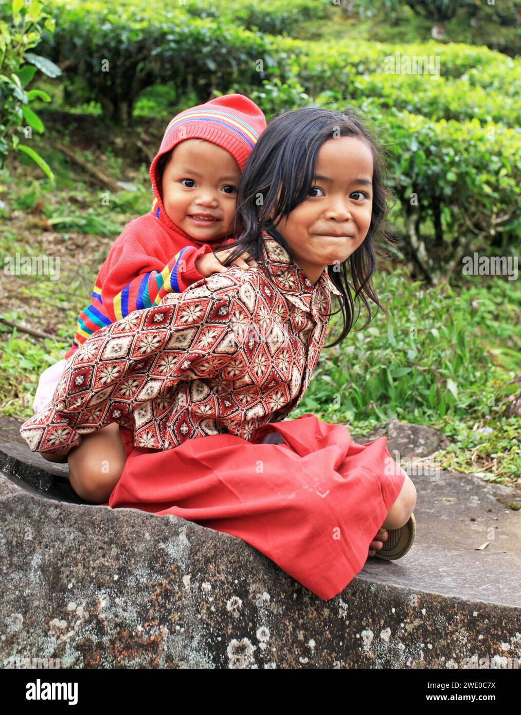 Young girl and baby in Ciwidey, West Java, Indonesia. Stock Photo