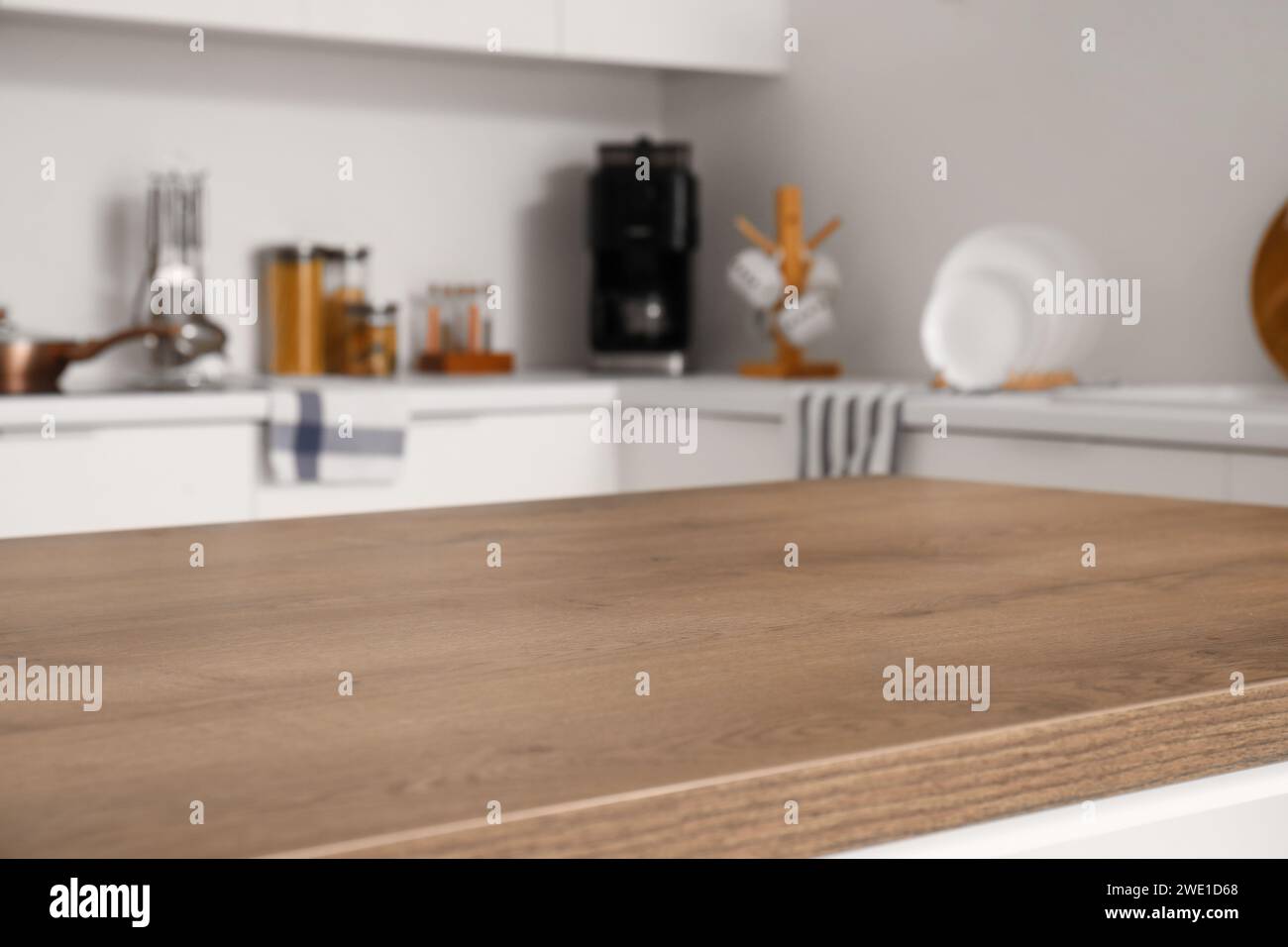 Clean wooden table in modern kitchen Stock Photo - Alamy